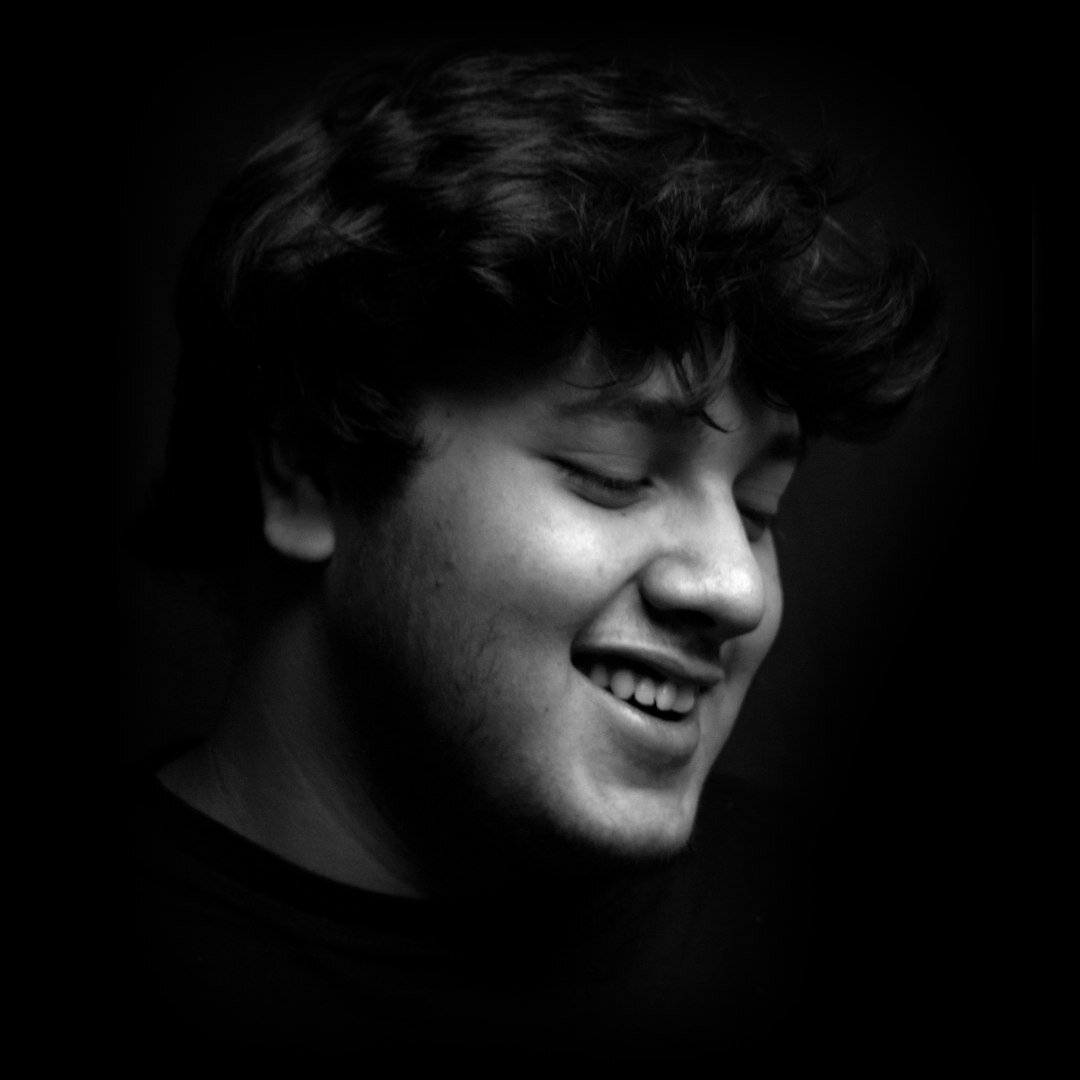 Studio portrait of a smiling young man