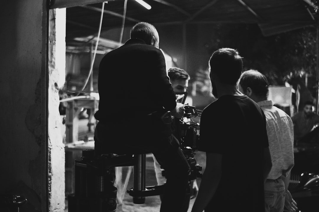 Film crew setting up cameras and lighting on location